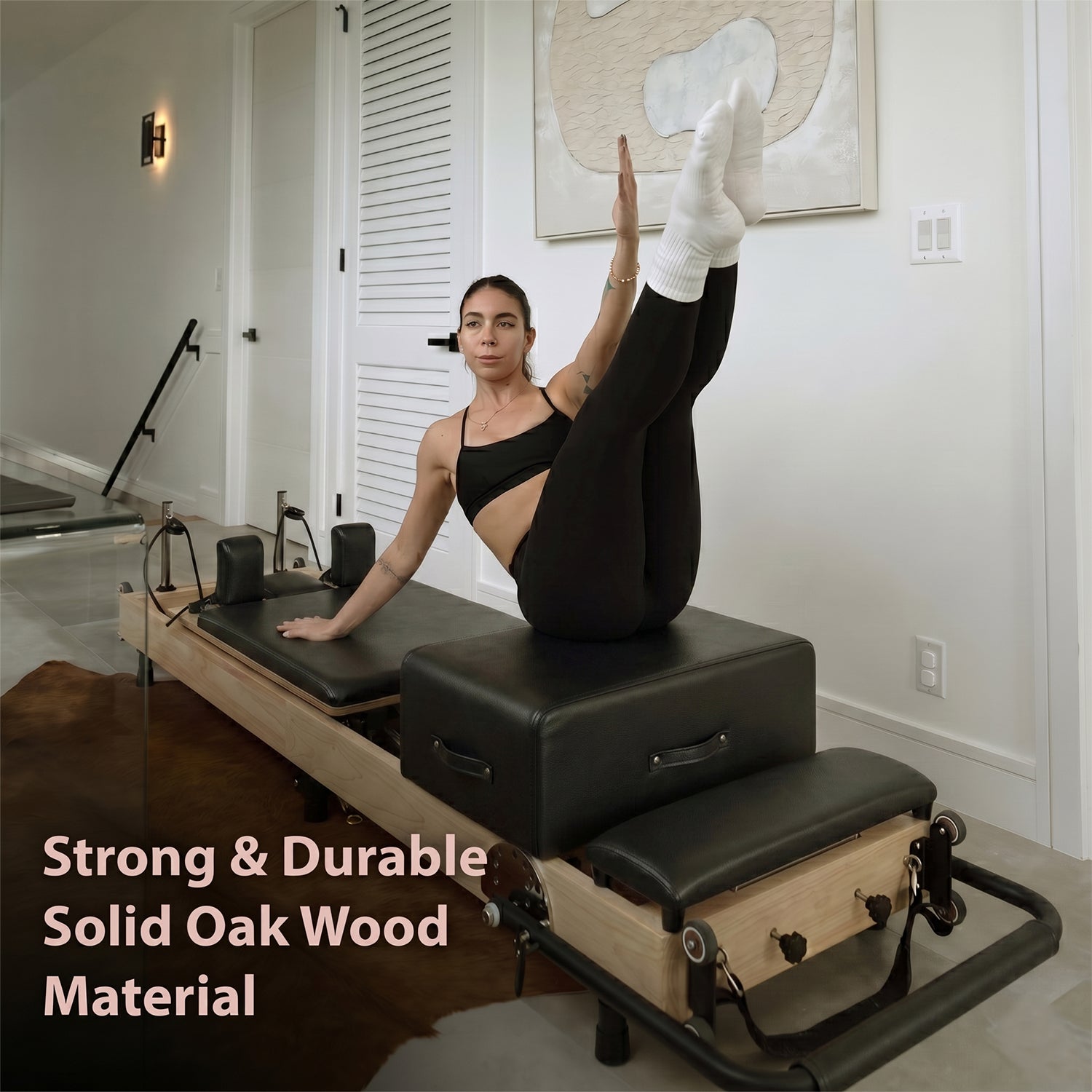 Woman performing at home reformer Pilates workout on a foldable reformer
